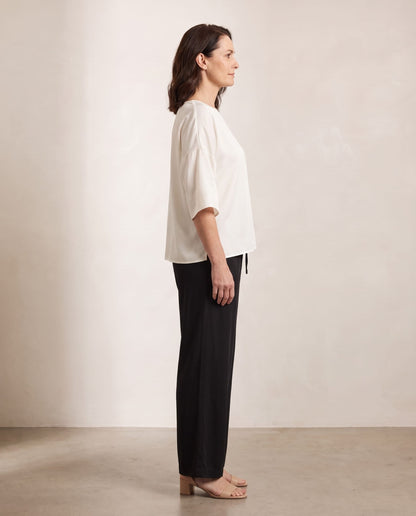 Oktavija Kate Top in ivory, side view, shown on a digitally generated model