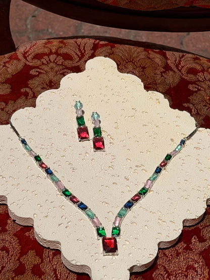Emerald and ruby crystal necklace and drop earrings on display