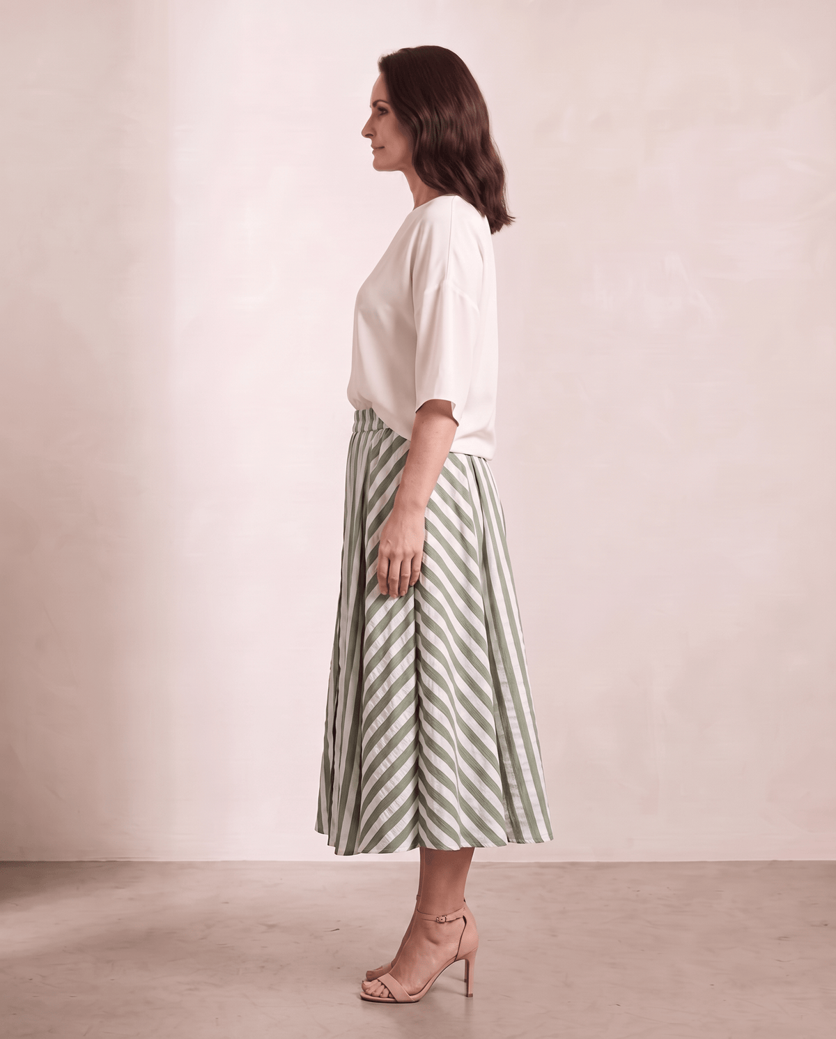 Willow Skirt in green stripe, side view, shown on a digitally generated model