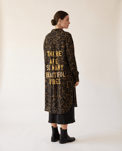 Higgsfield render - Leopard Print Beautiful Vibes Shirt rear three quarter