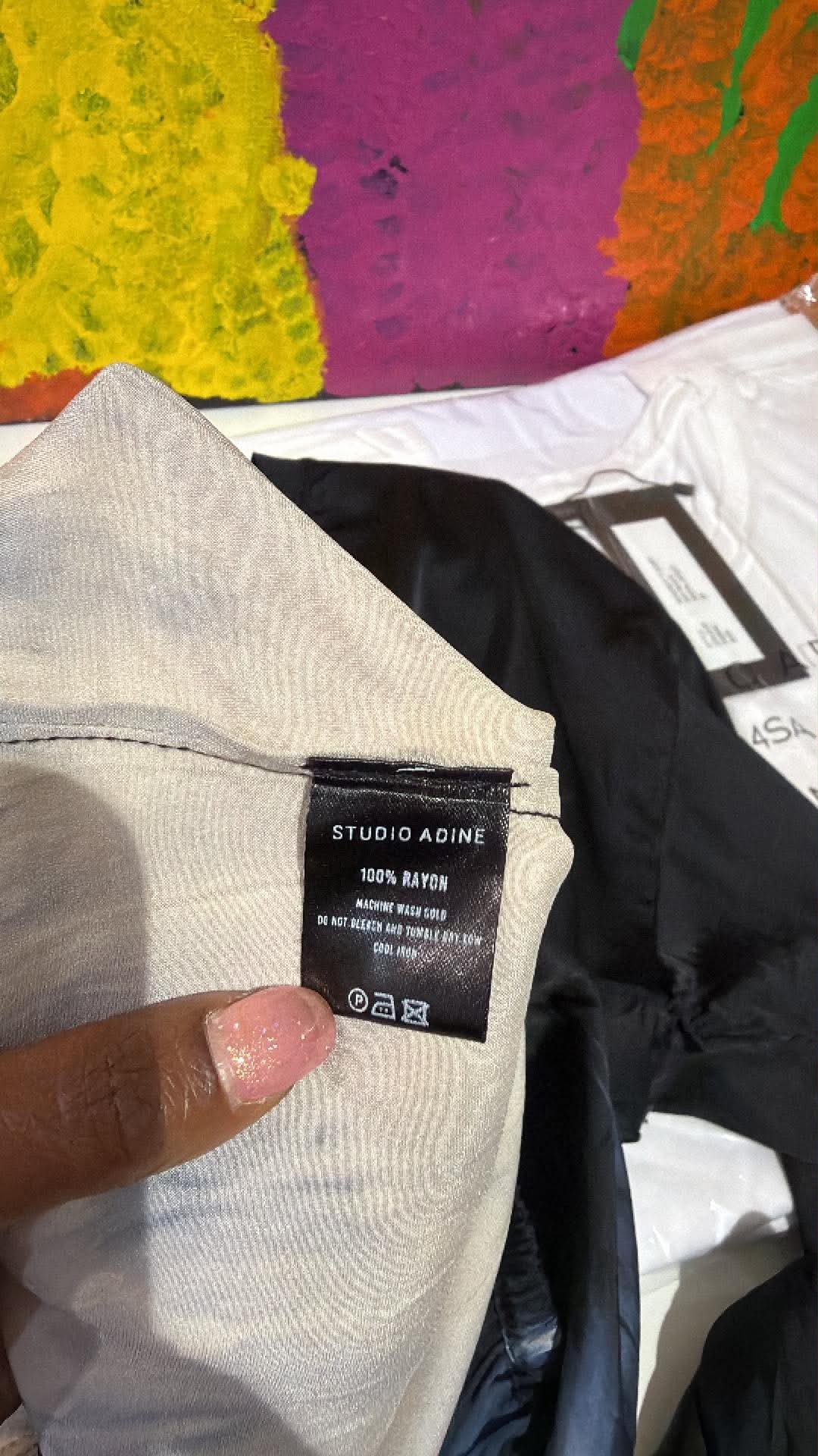 Christine supplier photo - care label on black satin with ecru lining, best guess Silu Crop Blouse (photo 37)